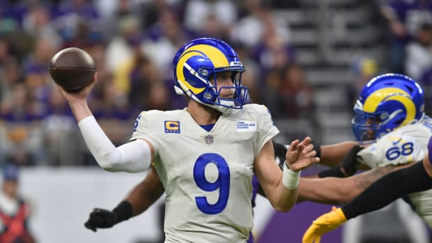 Dec 26, 2021; Minneapolis, Minnesota, USA; Los Angeles Rams quarterback Matthew Stafford (9) throws a pass against the Minnesota Vikings during the second quarter at U.S. Bank Stadium. Mandatory Credit: Jeffrey Becker-USA TODAY Sports